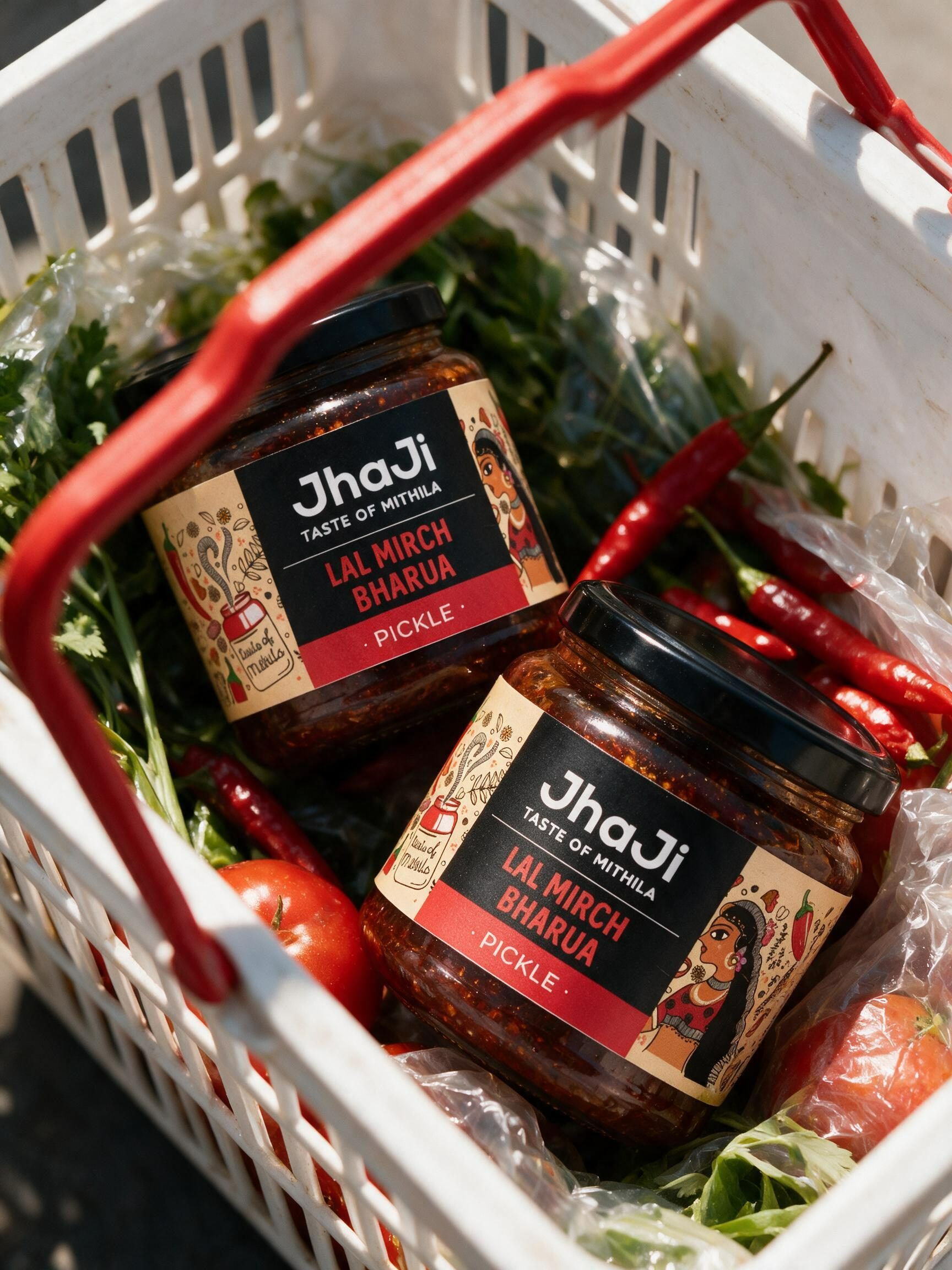 Two product jars inside a white grocery basket with fresh vegetables