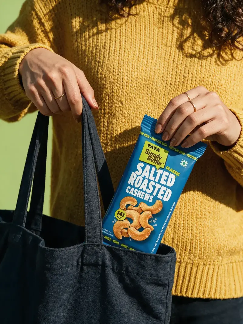 Outdoor lifestyle product photograph showing a packet being removed from a tote bag