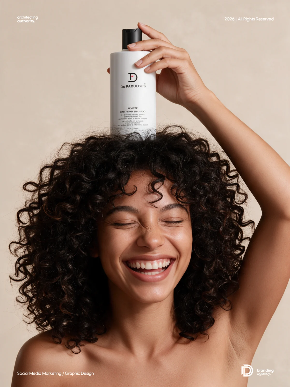 Smiling curly-haired woman holding a white haircare bottle above her head