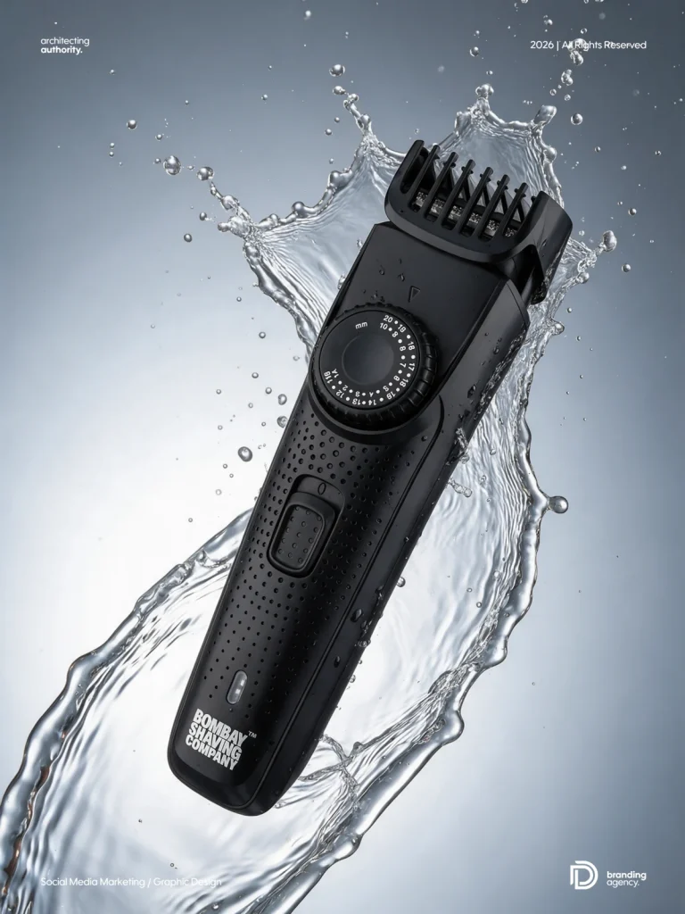 Bombay Shaving Company trimmer suspended in a crystal-clear water splash on a silver-grey background